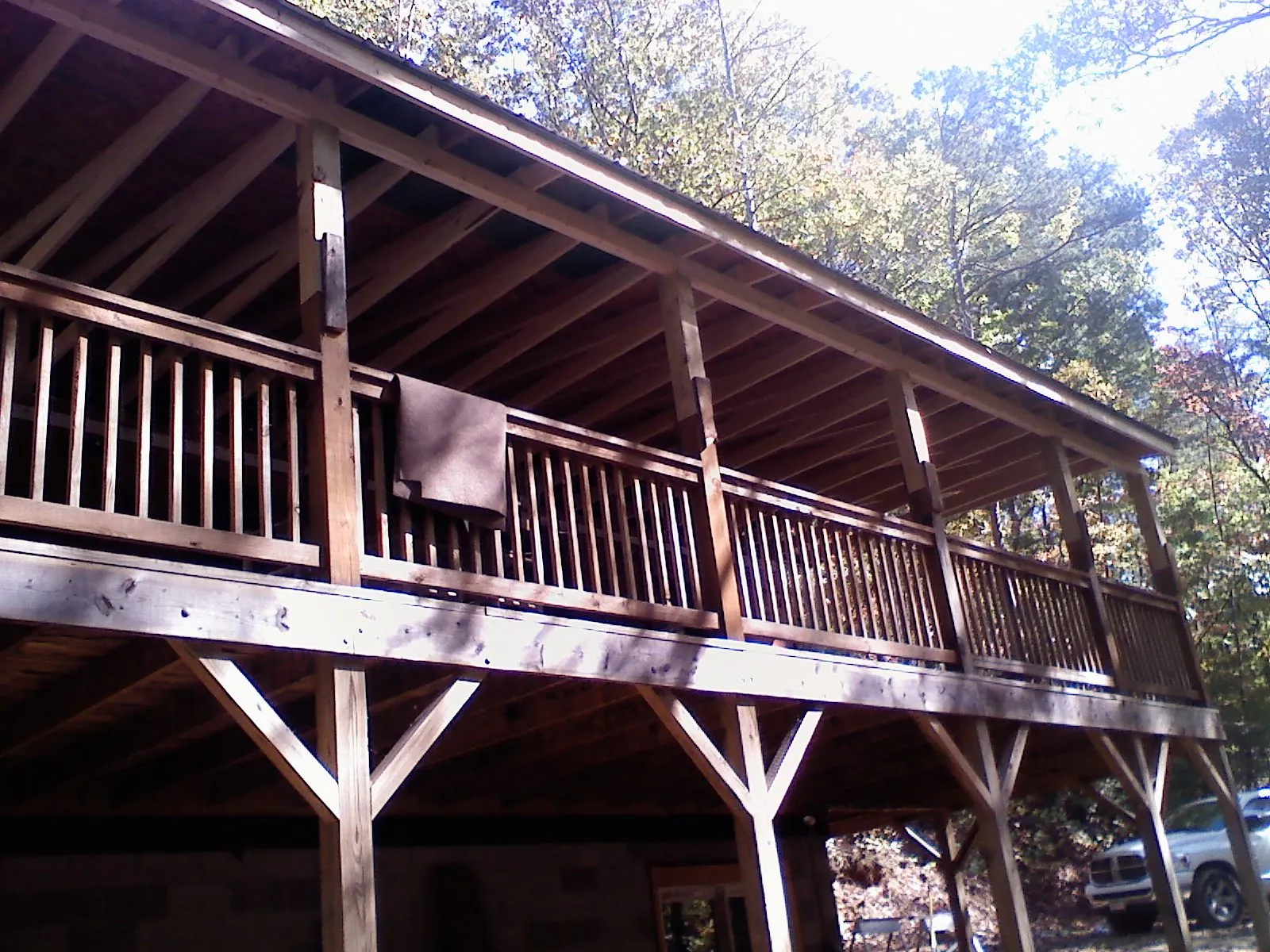 Timber framing under a new elevated porch and deck — Roof Leak Repair in Osage City by Roofing Brothers